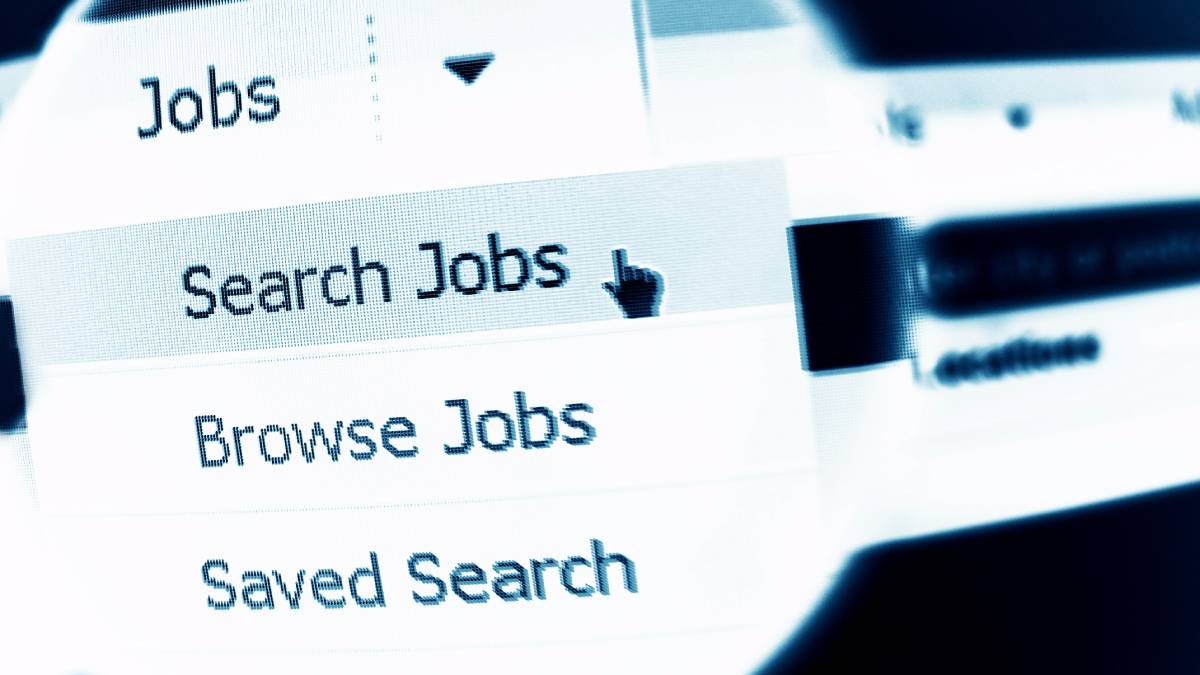 A close-up view of a computer screen displaying a job search webpage with menu options such as 'Jobs,' 'Search Jobs,' and 'Saved Search.'