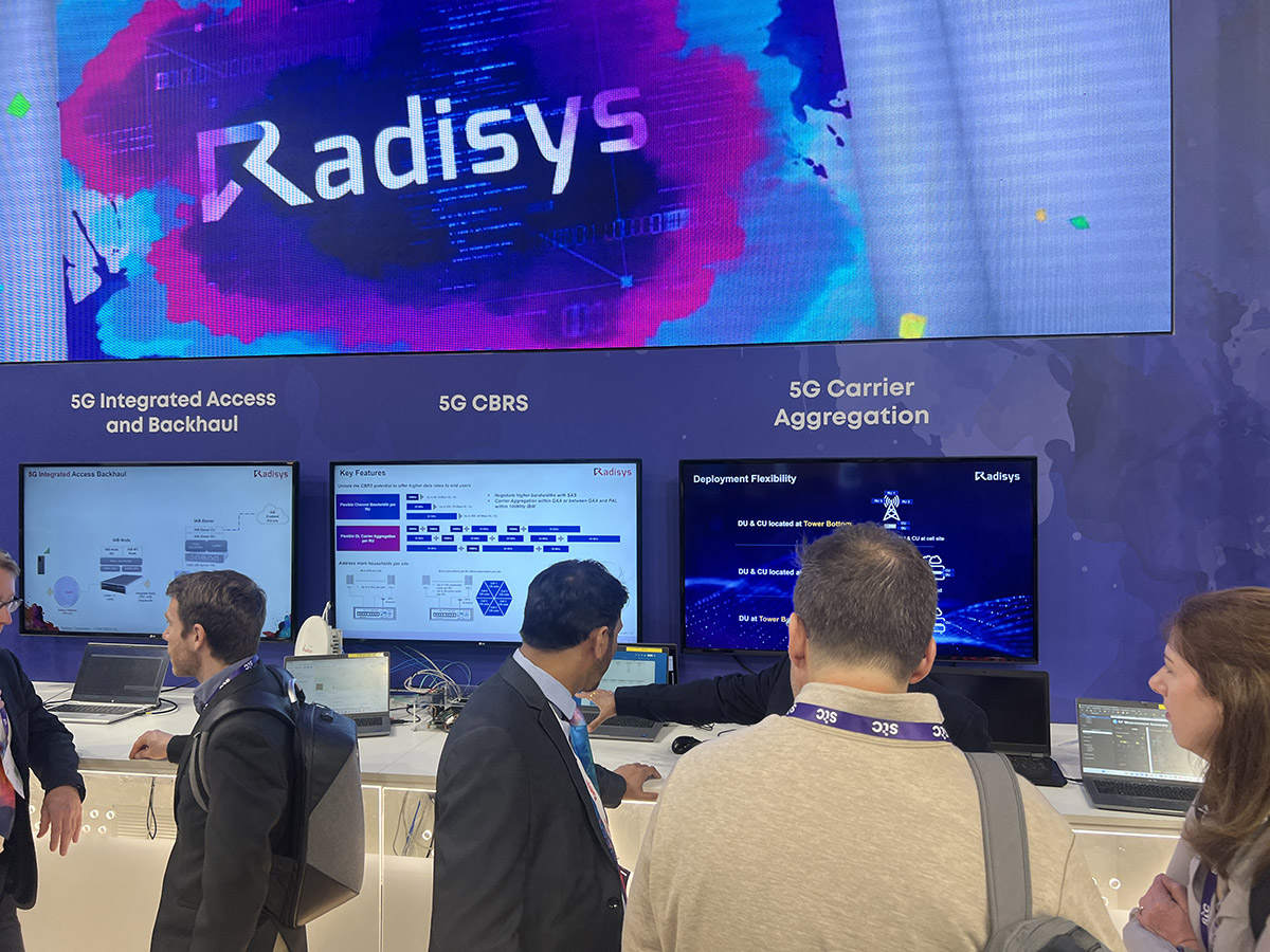 The Radisys exhibit showcasing a presentation about '5G Integrated Access and Backhaul', '5G CBRS' and '5G Carrier Aggregation'.