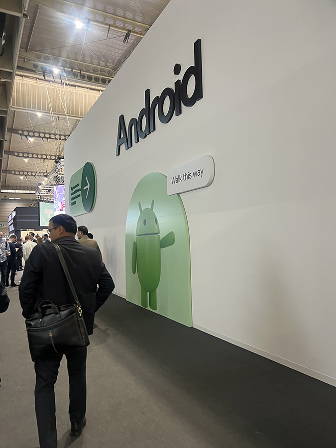 The Android booth with a large green Android mascot and signage directing visitors.