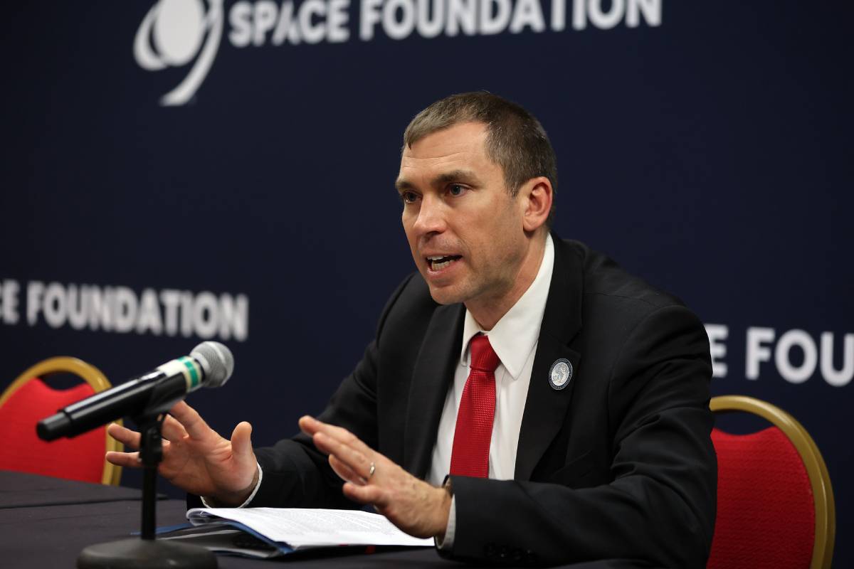 Derek Tournear, Director of the U.S. Space Force's Space Development Agency, gestures while speaking at a podium during the Space Symposium in Colorado Springs, Colorado.