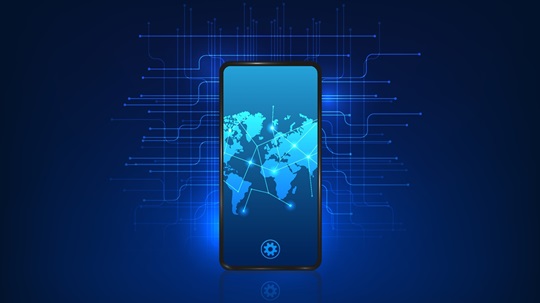 A smartphone with a world map network graphic on the screen against a blue digital circuit background.