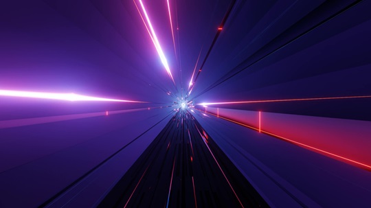 A digital 3D illustration of a futuristic tunnel with bright neon light rays converging towards a distant center, giving the impression of traveling at high speed through outer space.