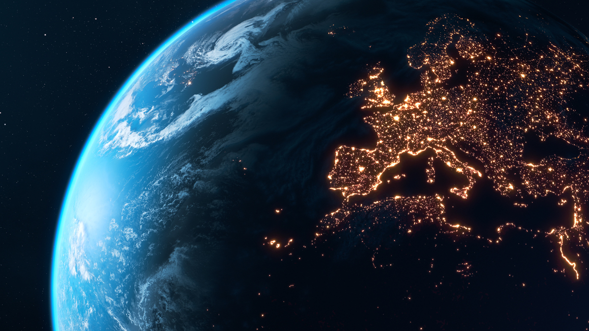 A view of Earth from space at night, with the city lights of Europe and the UK brightly illuminating the continent.
