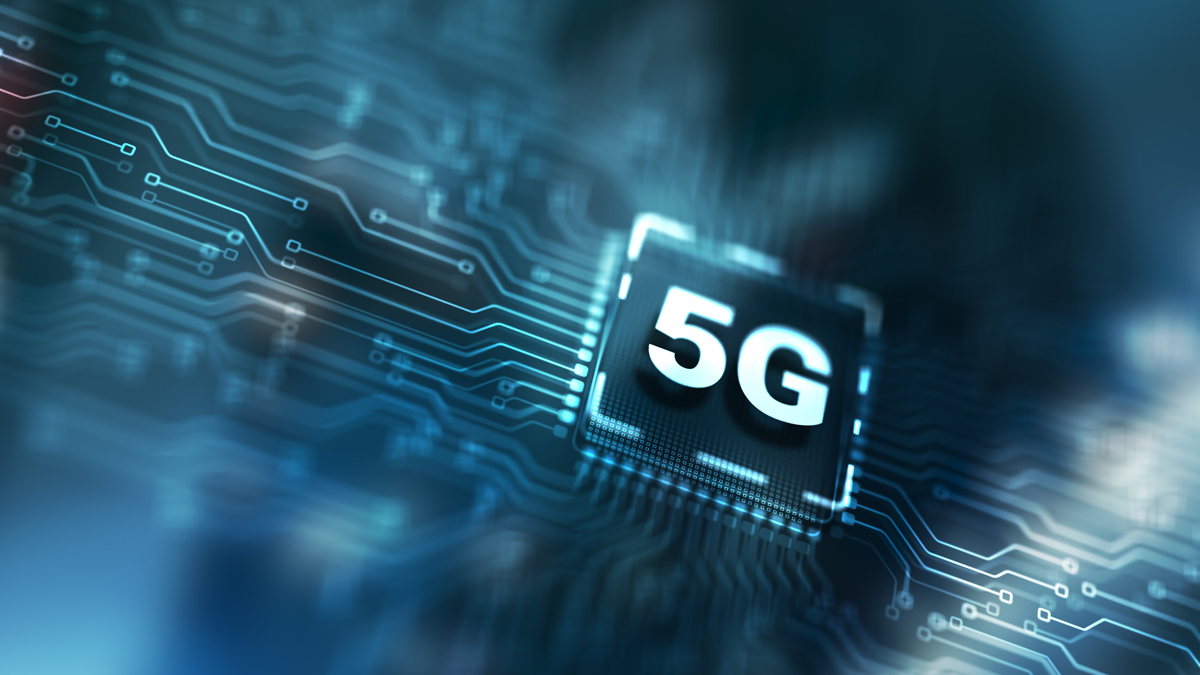 A glowing 5G chip is prominently displayed on a complex circuit board, symbolizing advancements in mobile technology.