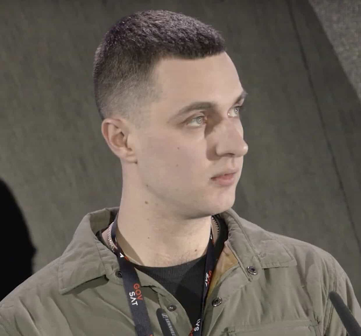 Headshot of Lt. Col. Serhiy Koziy Olehhovych wearing a green jacket and GovSat lanyard, looking slightly to his right.
