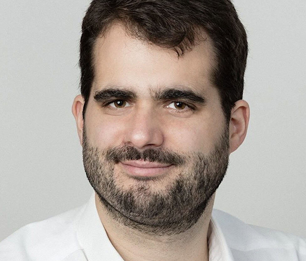 Jean-François Morizur, with dark hair and a beard, smiling slightly.