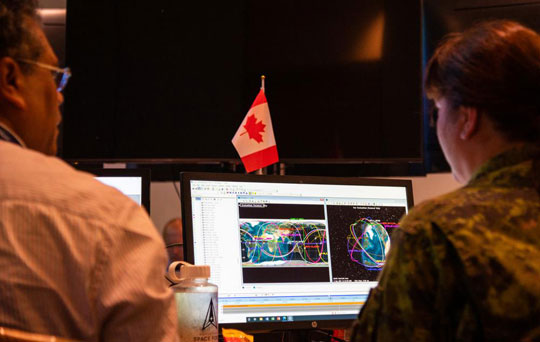 Participants from the Royal Canadian Air Force monitor, analyze and report a satellite close conjunction in low earth orbit during day six of Global Sentinel 2022 at Vandenberg Space Force Base, Calif., Aug 1, 2022.