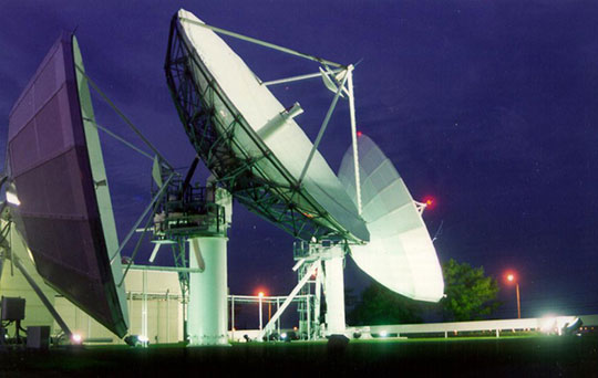 Satellite dishes at night
