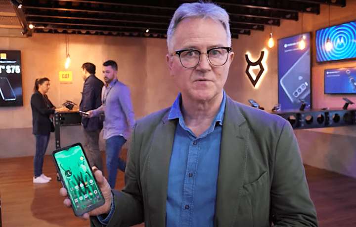 Bullitt Chief Product Officer Jonathan Nattrass showing the company's L- and S-band satellite-connected phone at Mobile World Congress 2023.