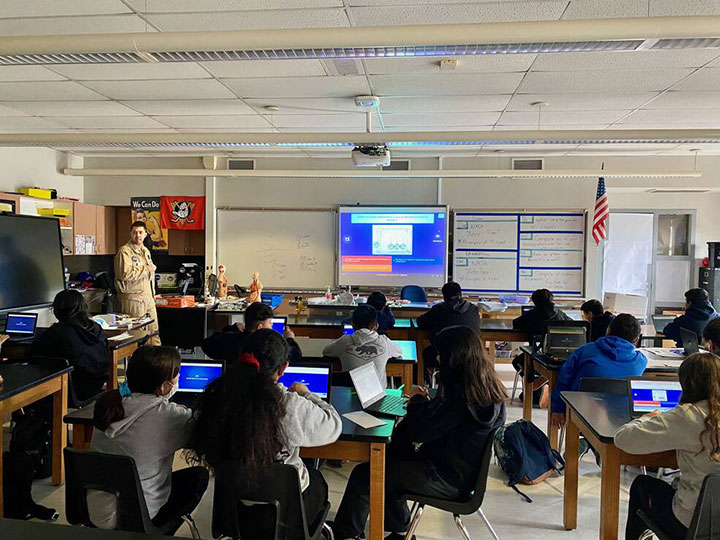 NASA Armstrong's Operations Engineer, Joe C. Piotrowski leads students at Mendez Fundamental Intermediate School in Santa Ana, California during a lesson in aeronautics at the June 2023 Aero Fair.